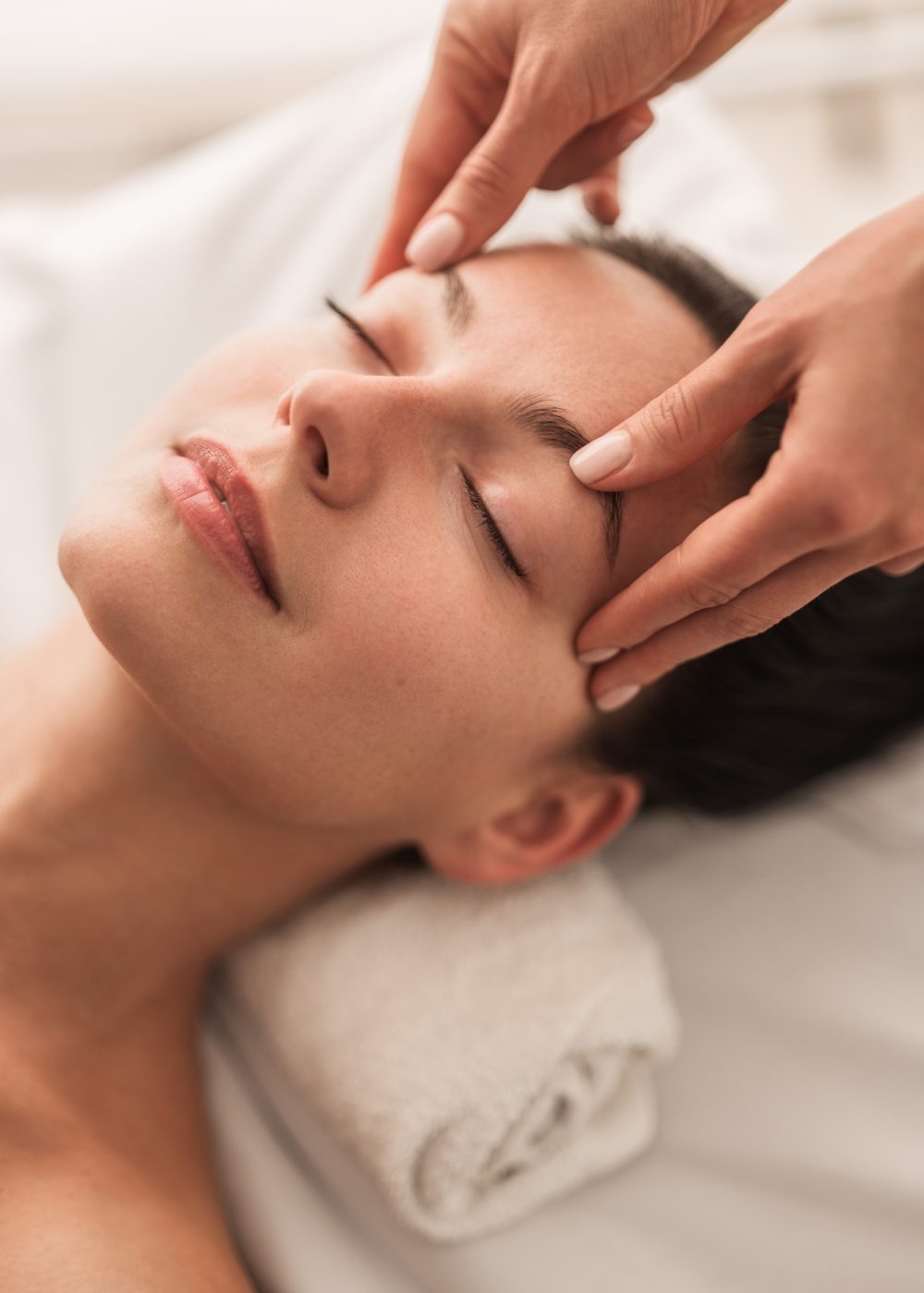 Woman during face massage in salon